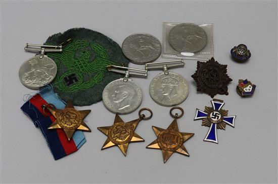 A World War II medal group plus German cloth badge and Mothers medal